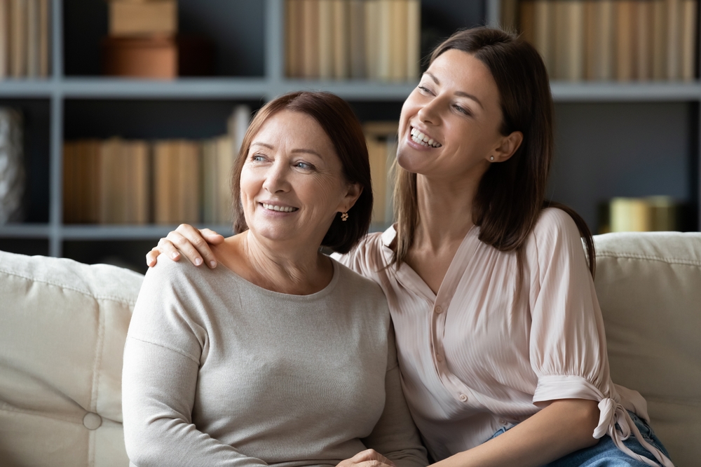 A warm interaction between a mother and daughter, representing confidence, self-care, and generational beauty - Plastic Surgeon in Philadelphia